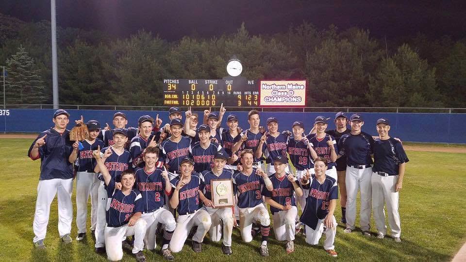 The Patriots baseball team celebrating a Northern Maine Class D championship under the lights
