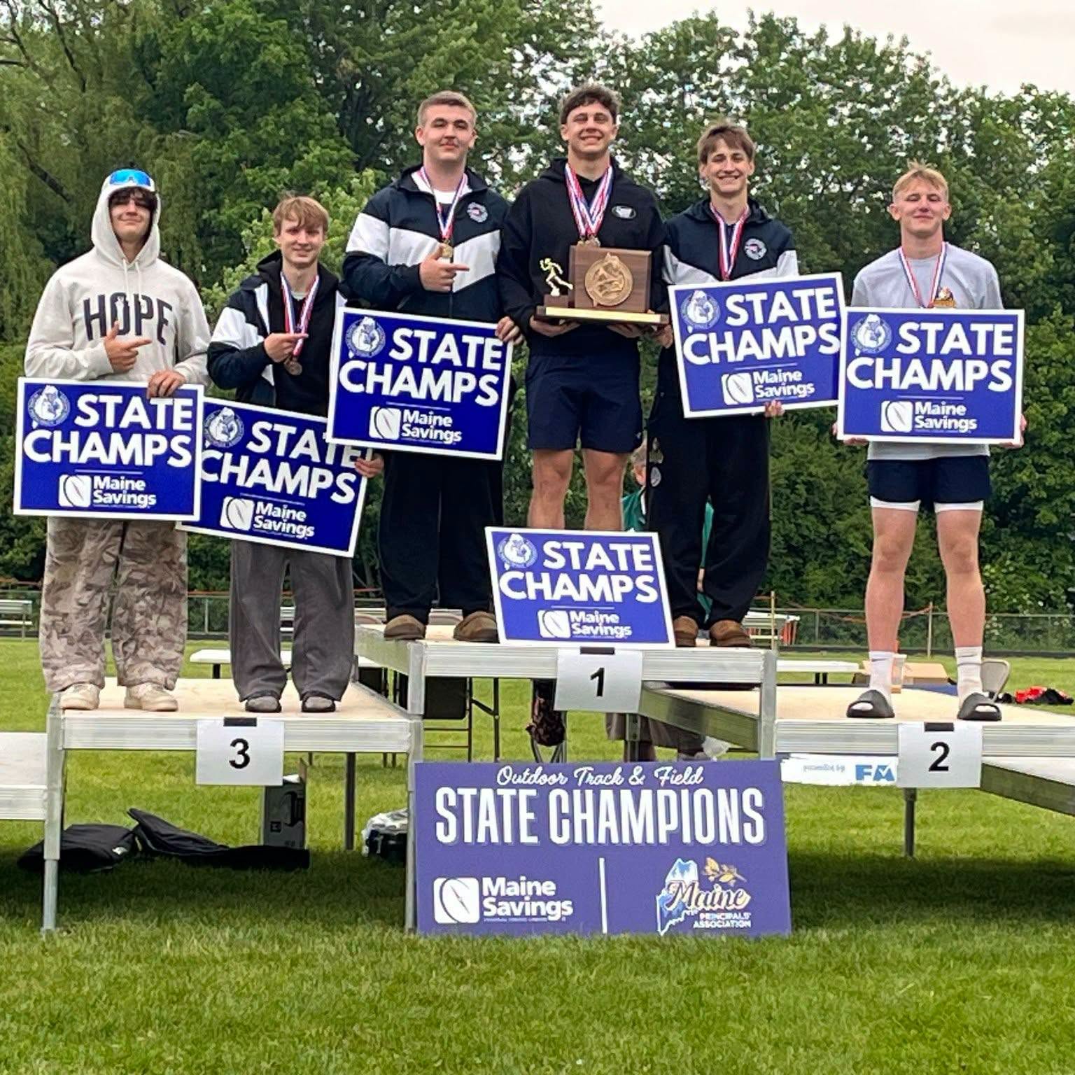 Patriots boys track team on the podium at the Outdoor Track and Field state championships